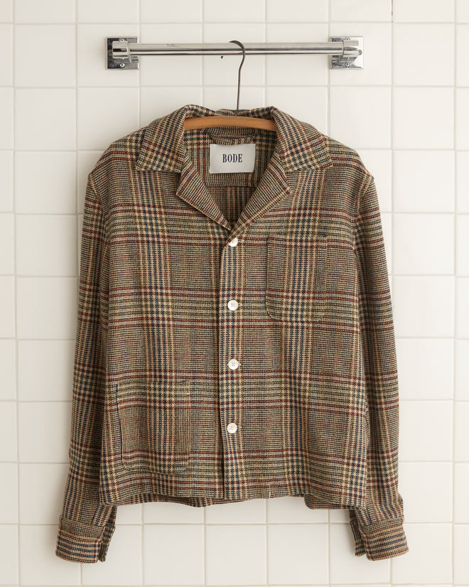 A Teatime Plaid Long Sleeve Shirt is displayed on a hanger against a tiled wall.