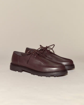 University Shoes - Brown: Elegant Italian calf leather lace-up shoes in dark brown with thick black soles, displayed on a light beige background.
