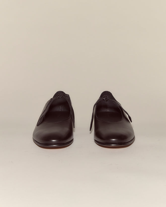 A pair of Verbena Shoes - Black, Italian-made leather Mary Janes, are shown facing forward against a plain light background.