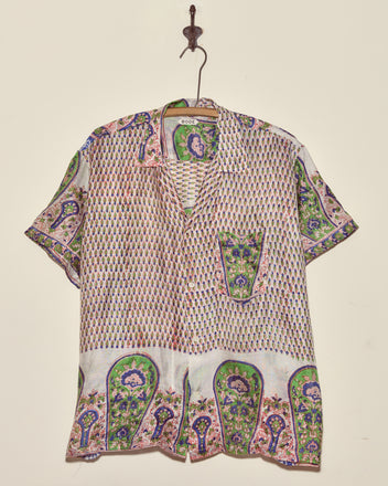 The Verdigris Print Shirt - XXL is a short-sleeve button-up crafted from vintage sari fabric with colorful paisley and geometric prints, making it a one-of-a-kind piece that adds unique charm to any wardrobe.