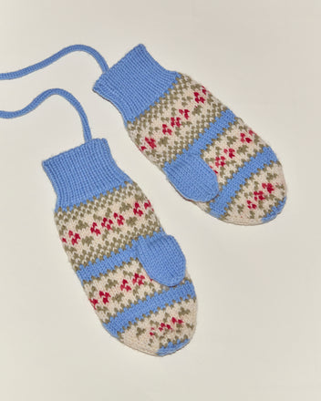 Wedgewood Mittens: vintage-inspired blue and beige mittens with red and white patterns, connected by a blue string, shown on a white background.