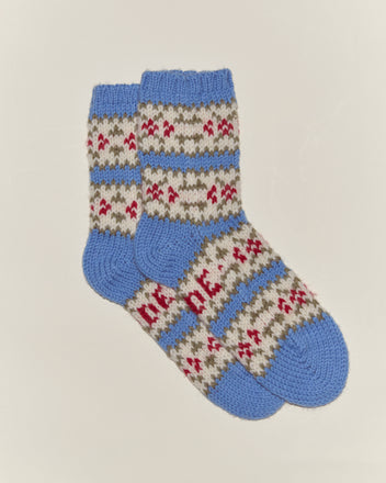 Wedgewood Socks—vintage-inspired in blue, gray, and red patterns—are arranged overlapping on a plain white background.