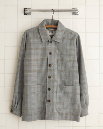 A Winchcombe Franck Jacket in a gray plaid suiting fabric, size S/M, is displayed on a tiled wall.