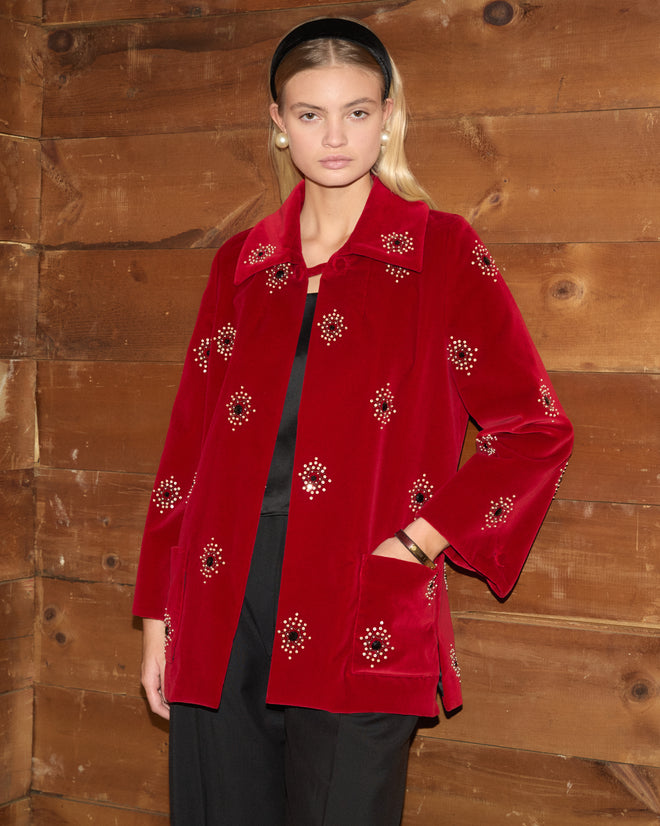 Luminaire Jacket in red velvet, embellished with crystal-like floral accents.