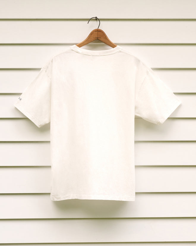 Yale at Norfolk Tee on a wooden hanger, displayed against a white horizontal siding wall and shown from the back—perfect for visitors to the Norfolk Historical Society or fans of concerts at the iconic Music Shed of the Yale School of Music.