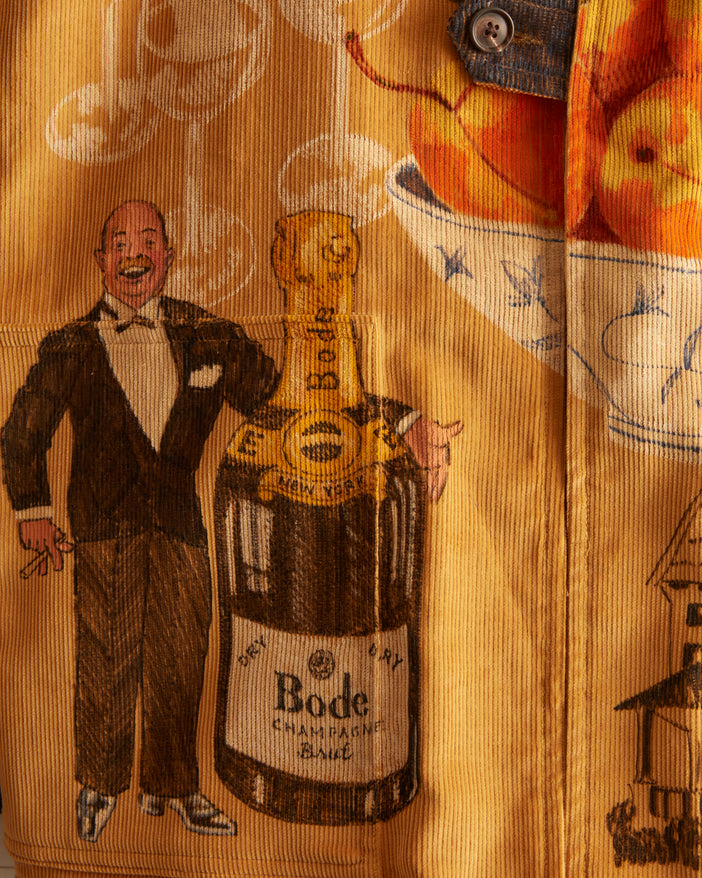 corn-colored British corduroy with hand-drawn illustrations in color with champagne motifs