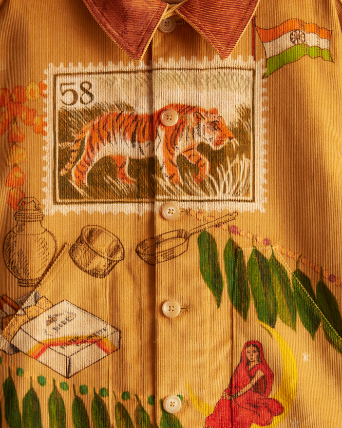 corn-colored British corduroy with hand-drawn illustrations in color with motifs from India